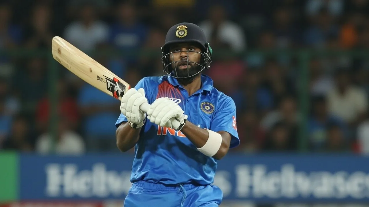 An India opener on the front foot playing through the off side during a T20I innings, with fielders crouched and the ball leaving the bat